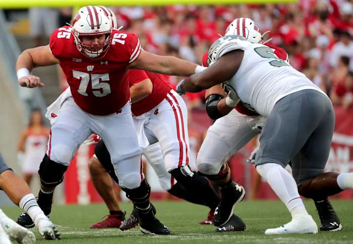 Wisconsin offensive lineman Joe Tippmann blocking against Eastern Michigan in 2021.